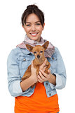 Portrait of a smiling young woman with pet dog