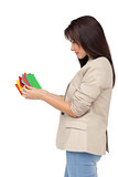 Young woman looking at colorful papers