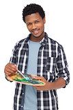 Portrait of a young male painter with palette