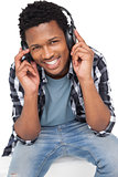 Portrait of a young man enjoying music