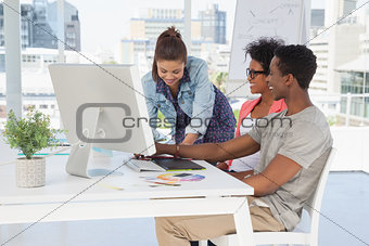 Artists working at desk in the creative office