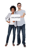 Portrait of a happy couple holding a volunteer note