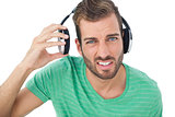 Portrait of a irritated young man with headphones