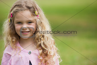 Close-up portrait of smiling girl at park