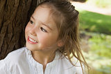 Smiling young girl looking away in park