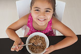 Close-up portrait of a girl having breakfast