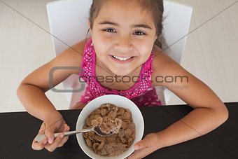 Close-up portrait of a girl having breakfast