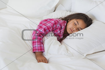 Young girl sleeping in bed at home