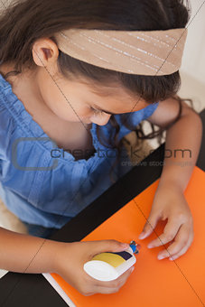 Close-up of a girl doing craftwork