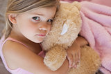 Close-up portrait of a girl with stuffed toy