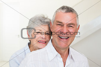Retired couple smiling at camera