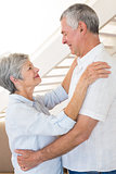 Affectionate senior couple dancing together