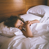 Close-up of a girl resting in bed