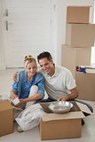 Couple sitting with boxes in new house