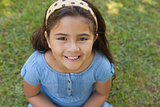 Portrait of a young girl smiling at park