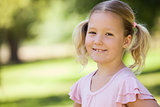 Close-up of a smiling girl at park