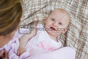 Portrait of a cute baby lying on blanket