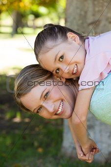 Happy mother and daughter at park