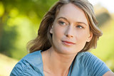 Close-up of thoughtful woman looking away in park