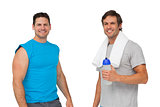 Portrait of two fit men with water bottle and towel