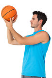 Serious basketball player with ball