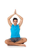 Full length portrait of a sporty men in meditation pose