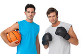 Fit men with boxing gloves and basketball