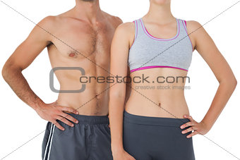 Mid section of a fit young couple