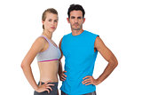 Portrait of a sporty young couple with hands on hips