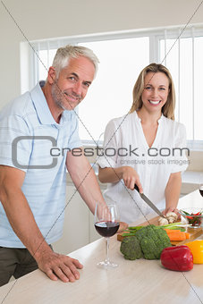 Cheerful couple making dinner together