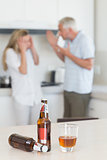 Angry couple arguing after drinking alcohol