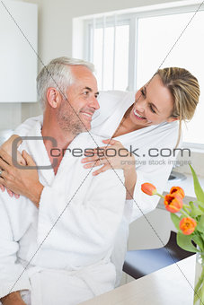 Happy couple embracing in the morning