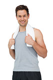Portrait of a smiling fit young man with towel