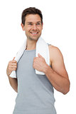 Portrait of a smiling fit young man with towel