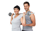 Personal trainer helping woman with weight lifting bar