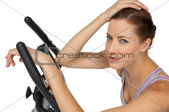 Close-up portrait of a beautiful young woman on stationary bike