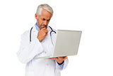 Concentrated male doctor using laptop