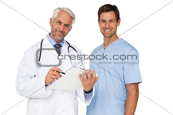 Portrait of male doctor and surgeon with reports