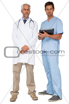 Portrait of male doctor and surgeon with digital tablet
