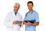 Portrait of male doctor and surgeon with digital tablets