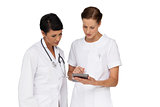 Two female doctors using digital tablet