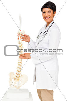 Portrait of a female doctor holding skeleton model