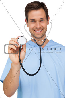 Portrait of a male surgeon using stethoscope