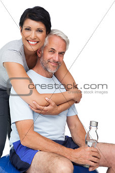 Portrait of a happy woman embracing man