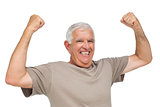 Portrait of a cheerful senior man with clenched fists