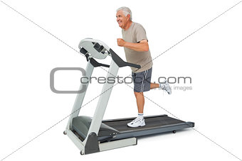 Full length of a senior man running on a treadmill