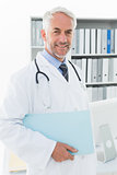 Portrait of a smiling male doctor at medical office