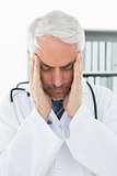 Close-up of a doctor with severe headache