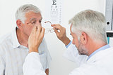 Man wearing glasses after taking vision test at doctor