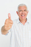 Portrait of a senior man gesturing thumbs up